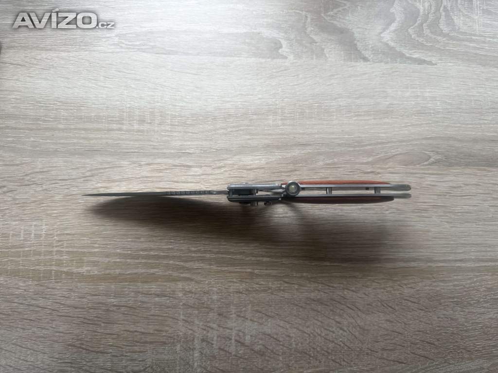 Foto inzerátu Kapesní zavírací (vystřelovací) nůž Dinosaur se svítilnou