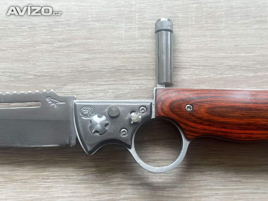 Foto inzerátu Kapesní zavírací (vystřelovací) nůž Dinosaur se svítilnou