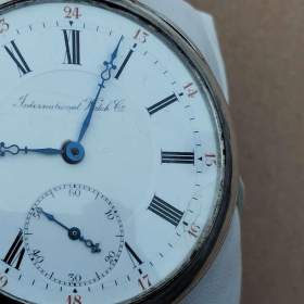 Foto inzerátu Starožitné stříbrné hodinky IWC Schaffhausen s krabičkou, páskem navíc, záruční list.