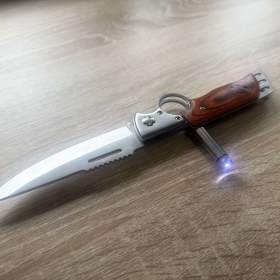 Foto inzerátu Kapesní zavírací (vystřelovací) nůž Dinosaur se svítilnou